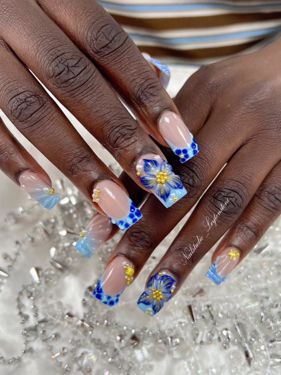 Blue French tips with 3D hibiscus flowers and gold beadwork