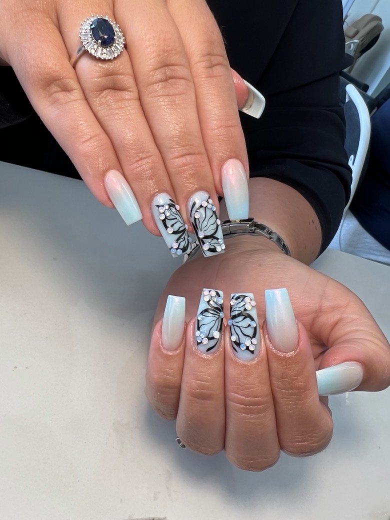 Ombré blue butterfly nail art with crystal detailing, hand-painted at Nail Studio Leytonstone